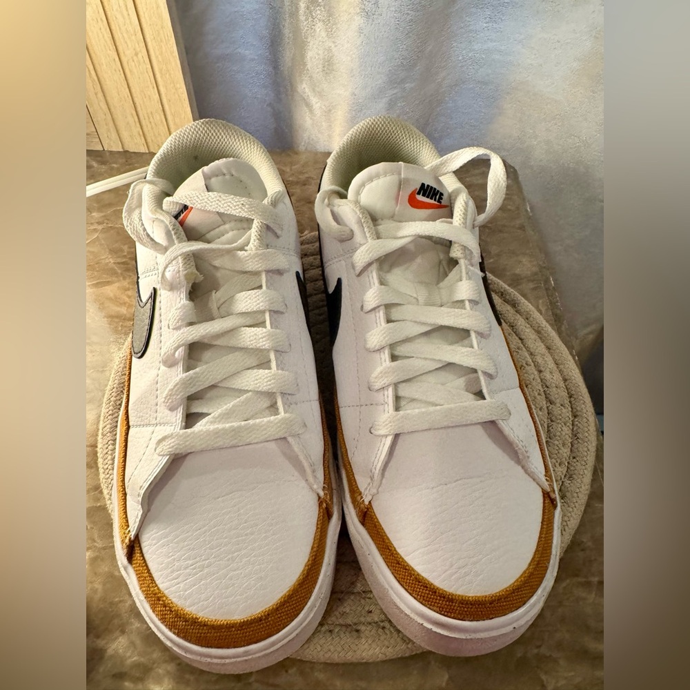 Nike Women’s White and Gold Sneakers
